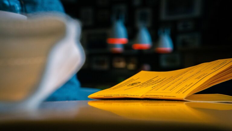 Close-up of a printed certification document placed on a table, highlighting the importance of eco-labels and certifications in ethical marketing practices.
